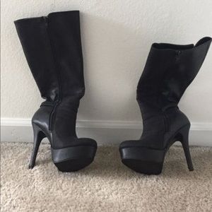 Black knee high heel knee high boots. Barely worn